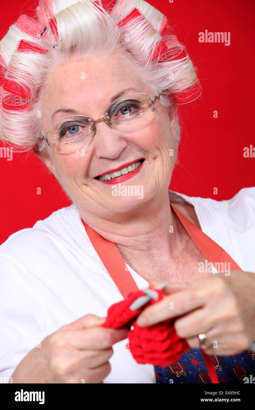 An old lady knitting. Stock Photo