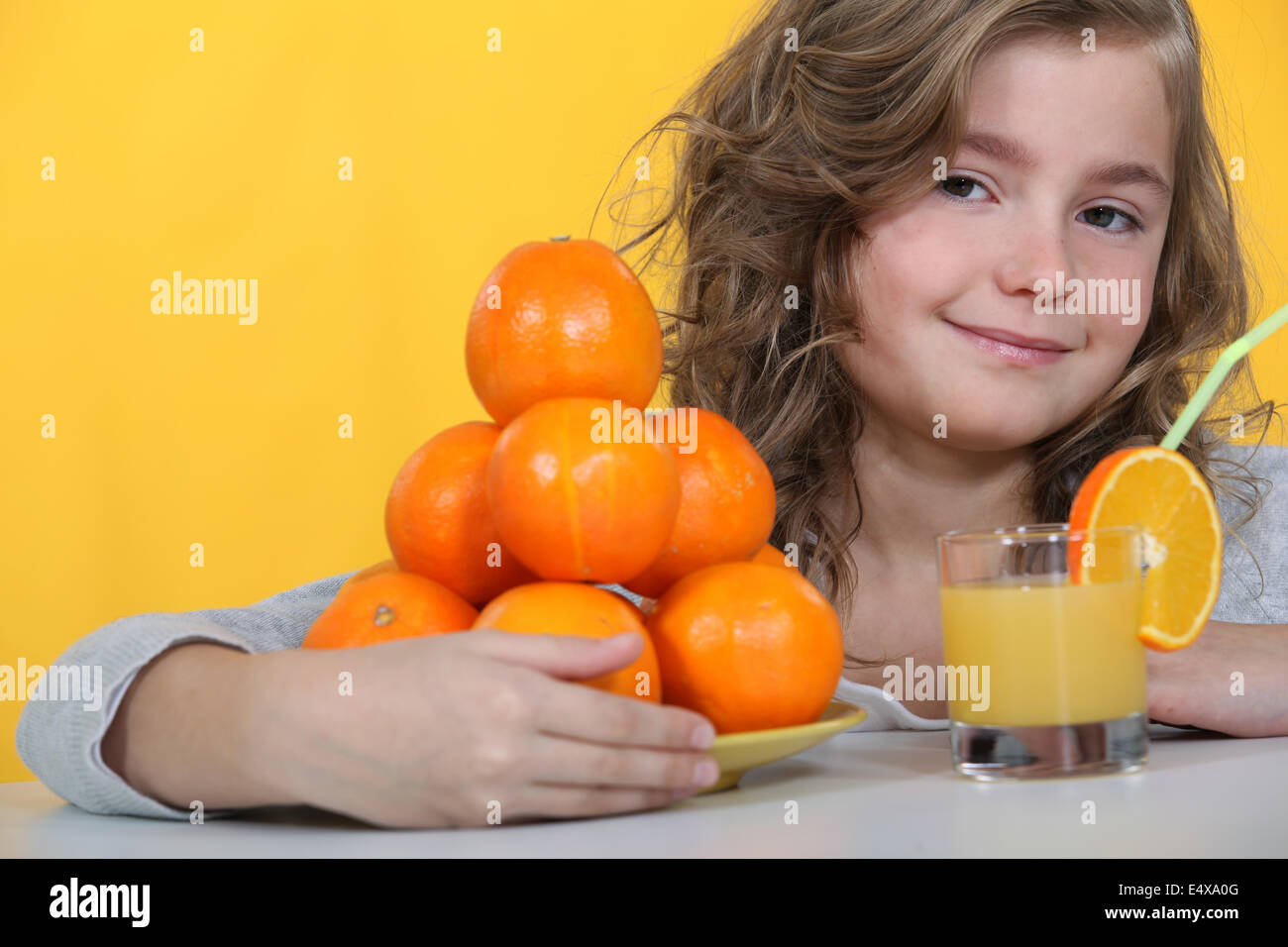 Kid drinking orange juice Stock Photo Alamy