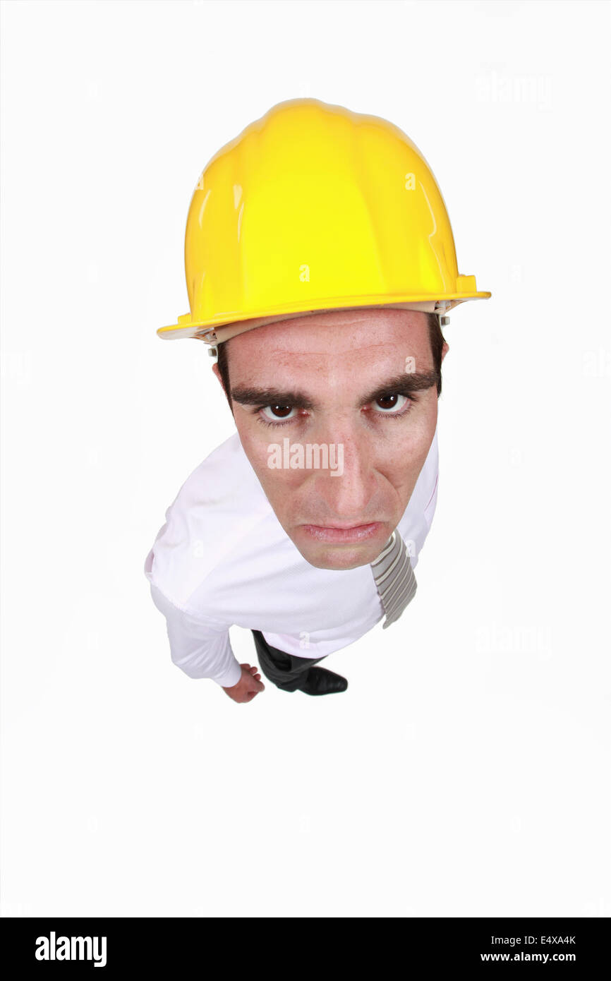 angry businessman wearing a helmet Stock Photo