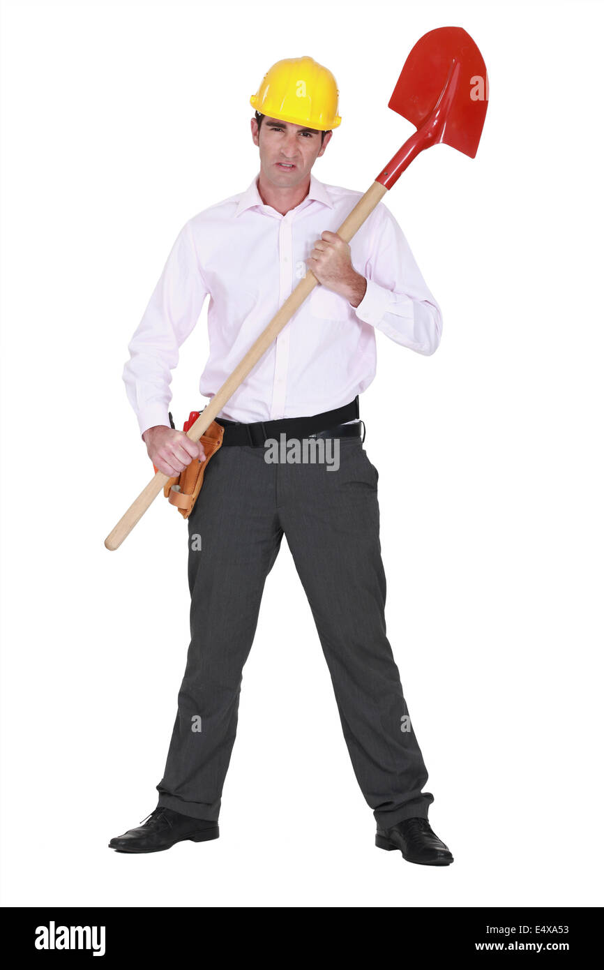 Businessman with a hardhat and shovel Stock Photo