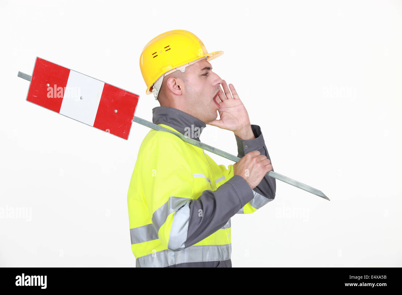 A road worker shouting instructions. Stock Photo