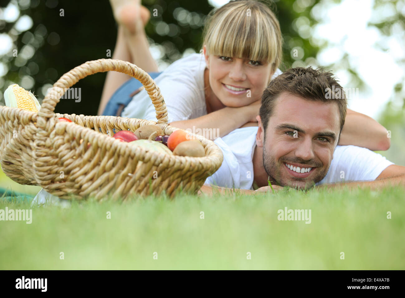 couple relaxing in the park Stock Photo - Alamy