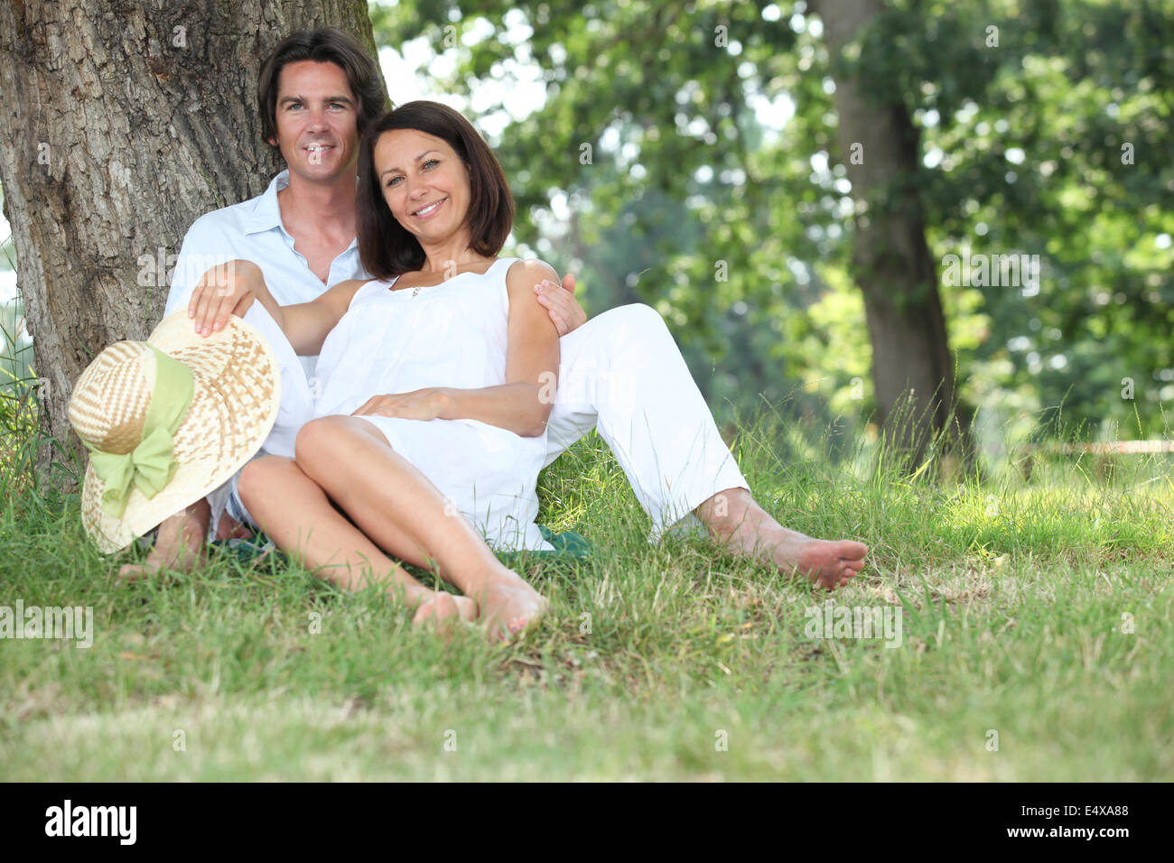 Couple relaxing in the shade Stock Photo