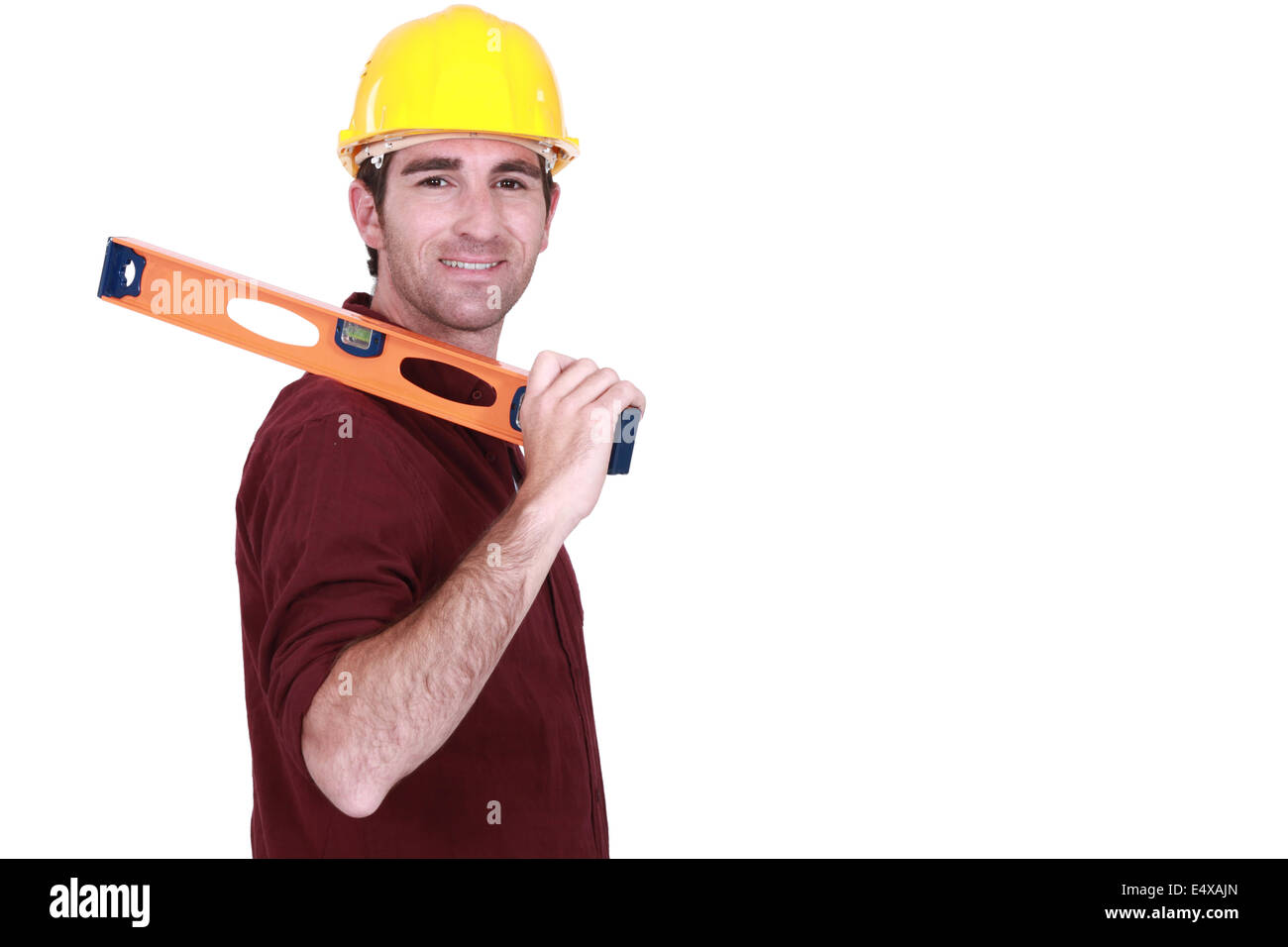 Tradesman carrying a spirit level Stock Photo