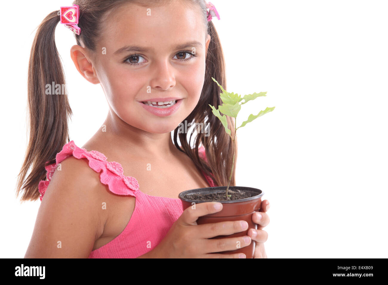 Girl with a plant Stock Photo