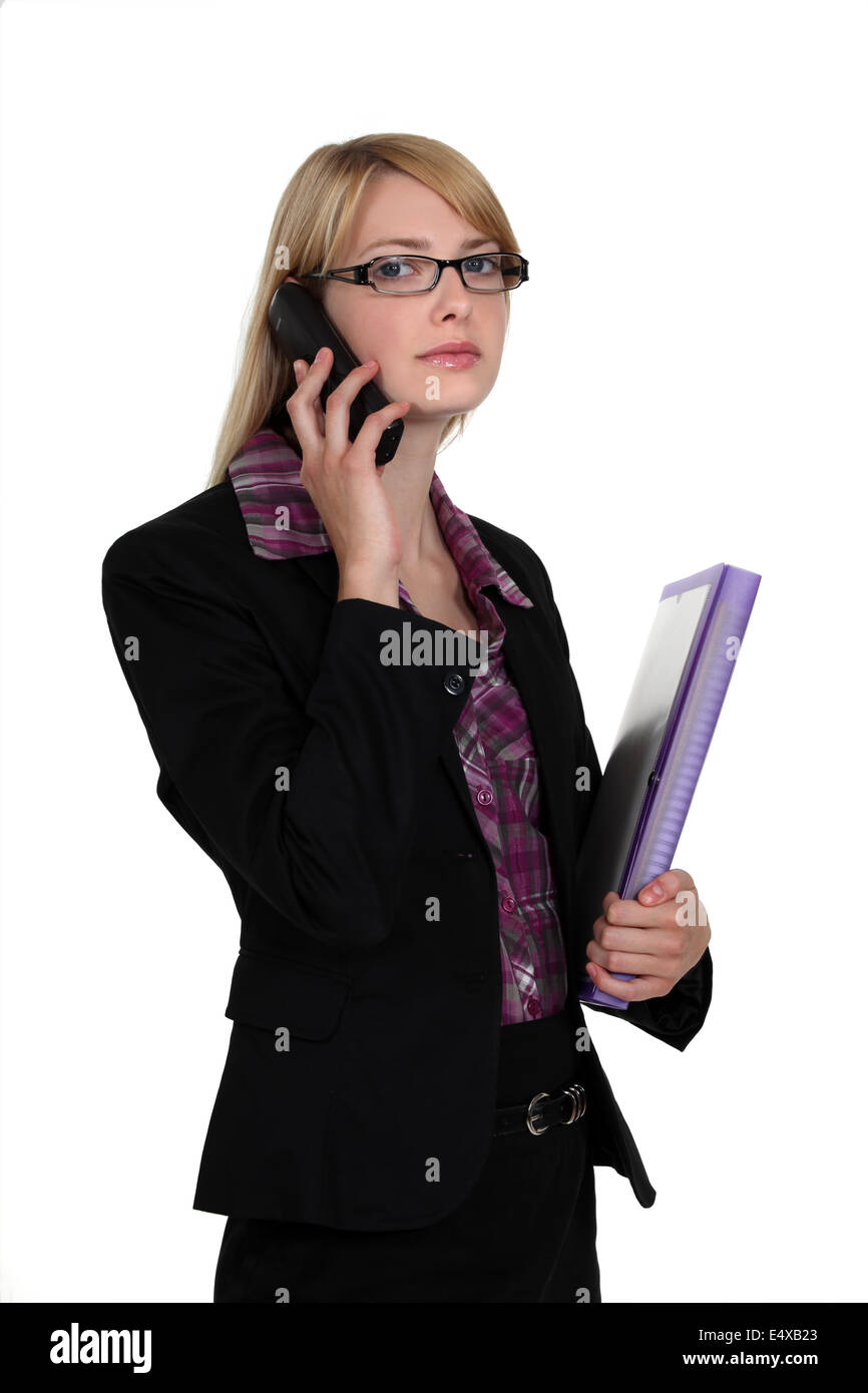 Blond businesswomen with folder and mobile Stock Photo
