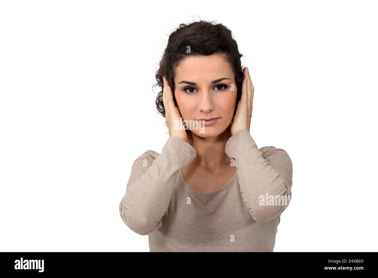 Woman covering her ears Stock Photo Alamy