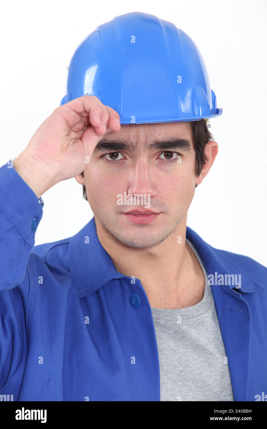 A construction worker saluting. Stock Photo