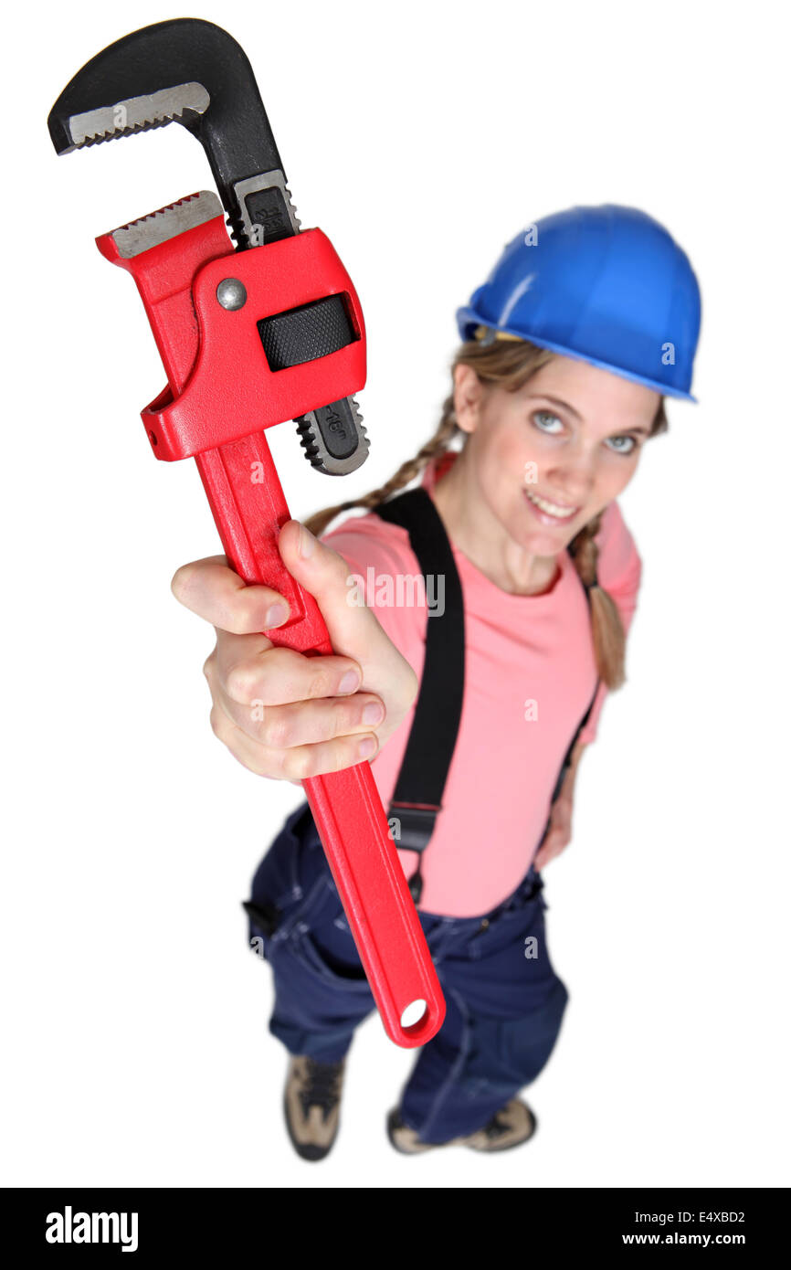 craftswoman holding a spanner Stock Photo