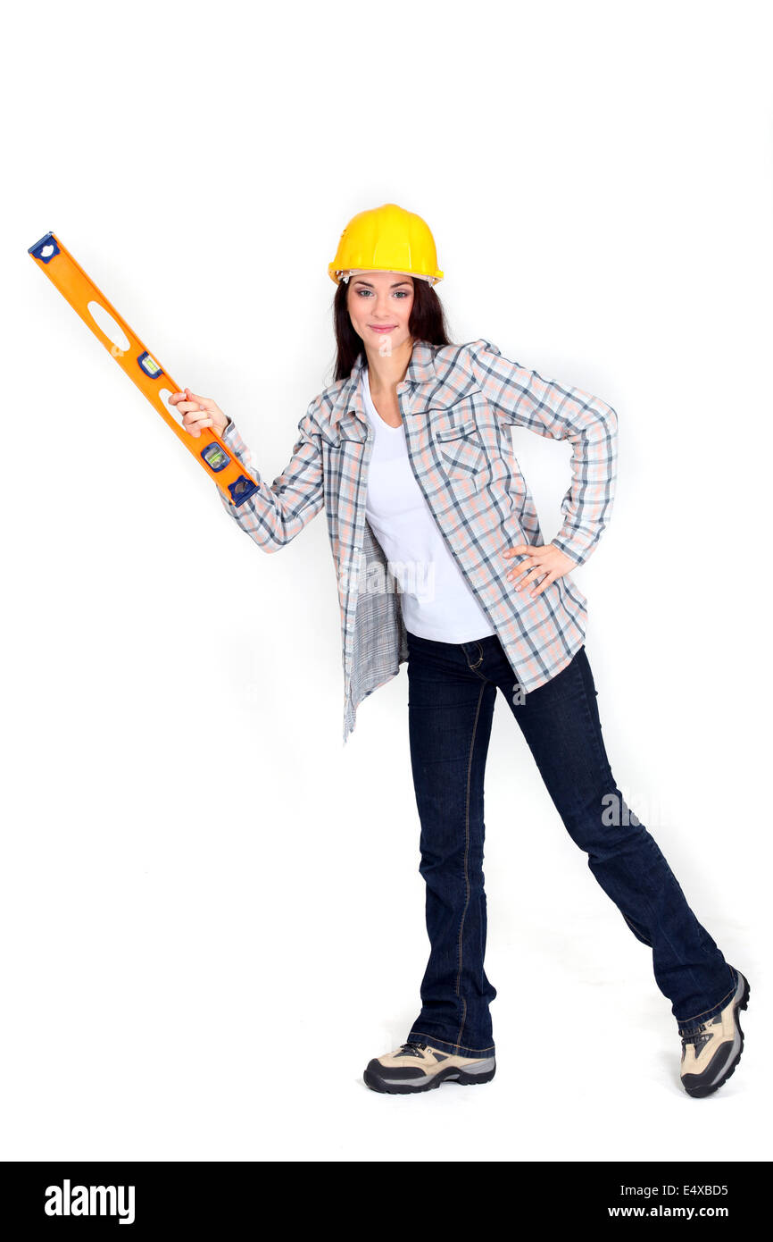 Woman with a spirit level Stock Photo