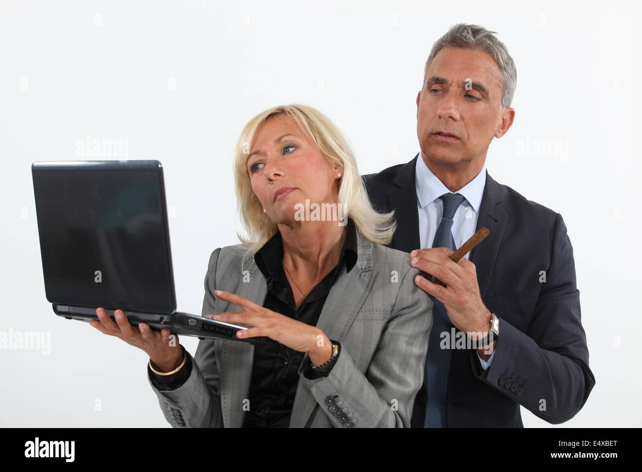 Man putting the moves on his co-worker Stock Photo