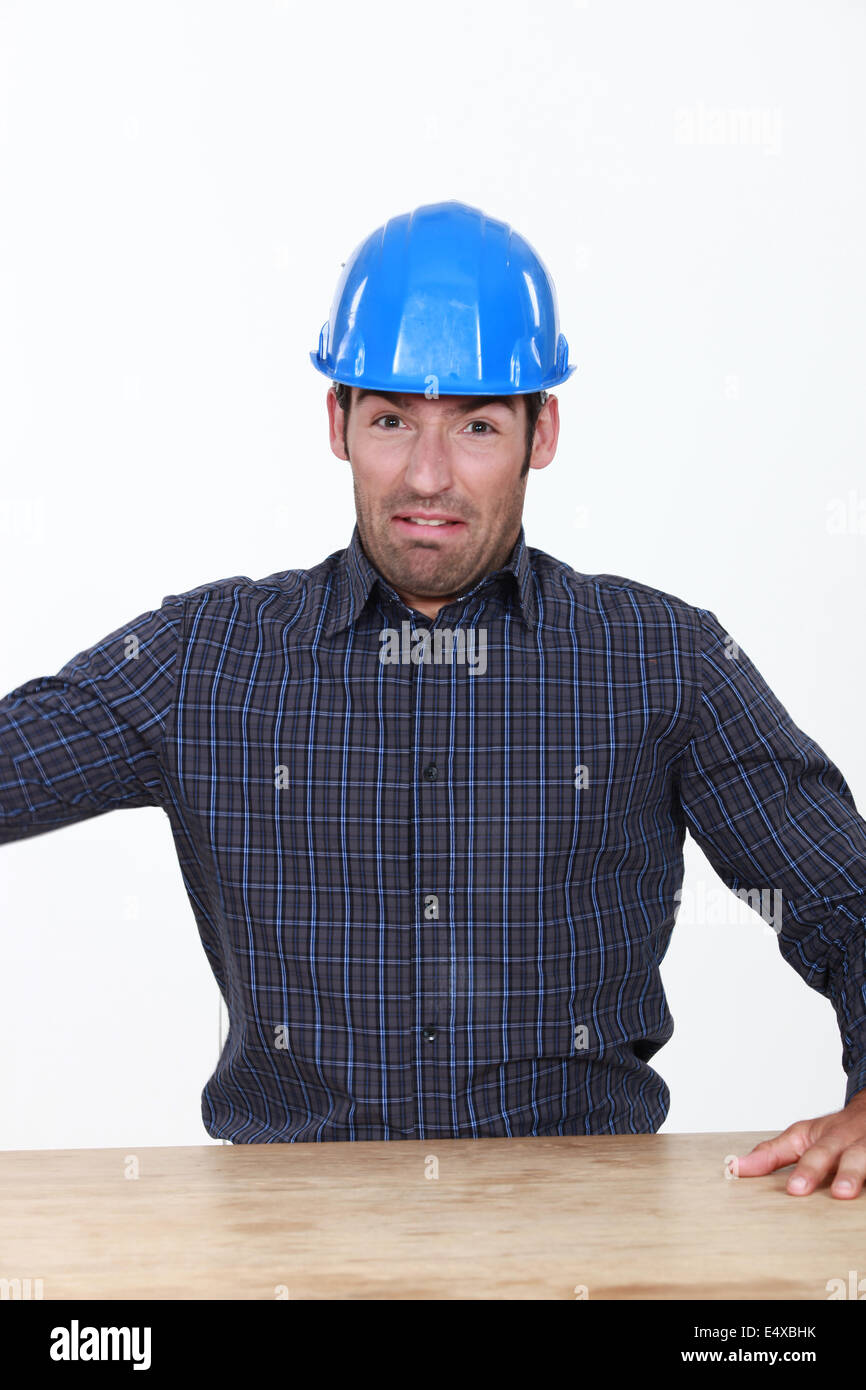 Terrified builder Stock Photo