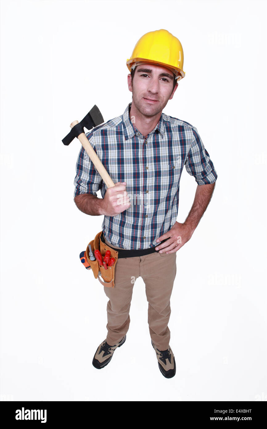 Tradesman holding a hatchet Stock Photo