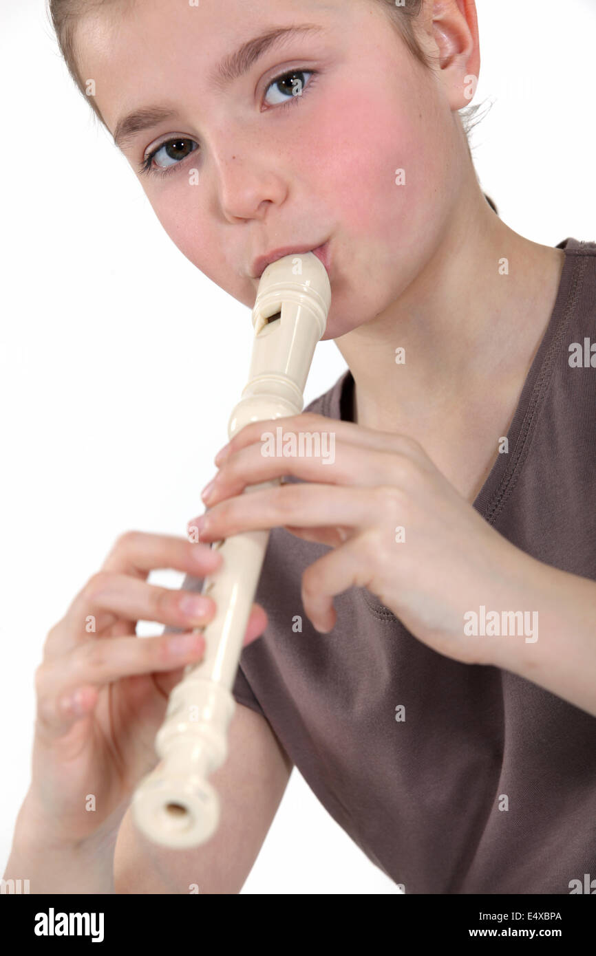 Girl playing flute Stock Photo