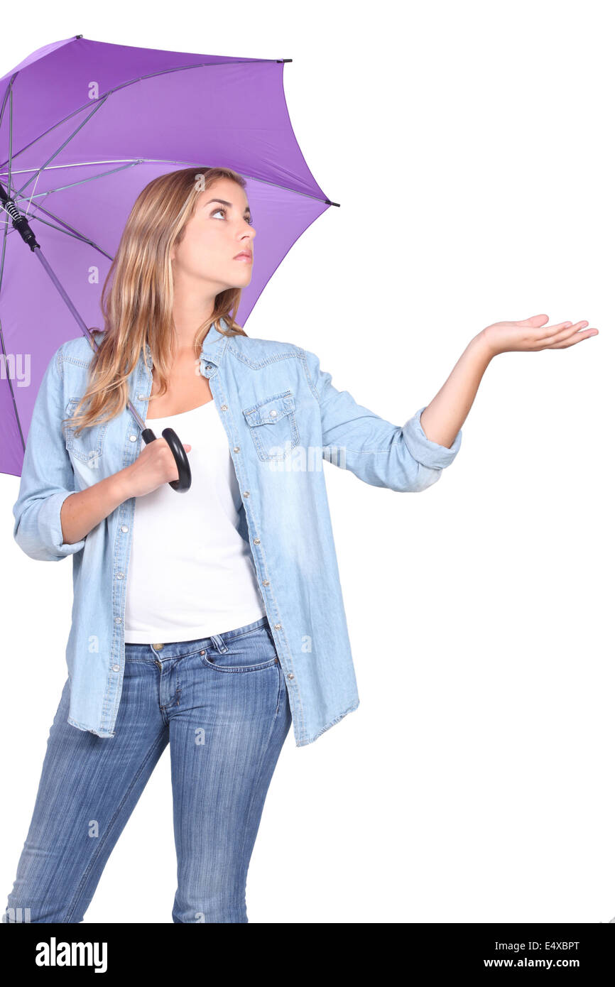 Woman checking for rain Stock Photo