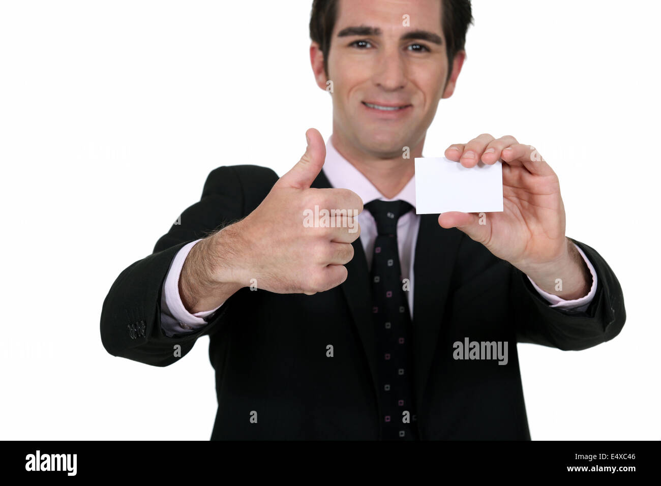 Happy businessman with card Stock Photo