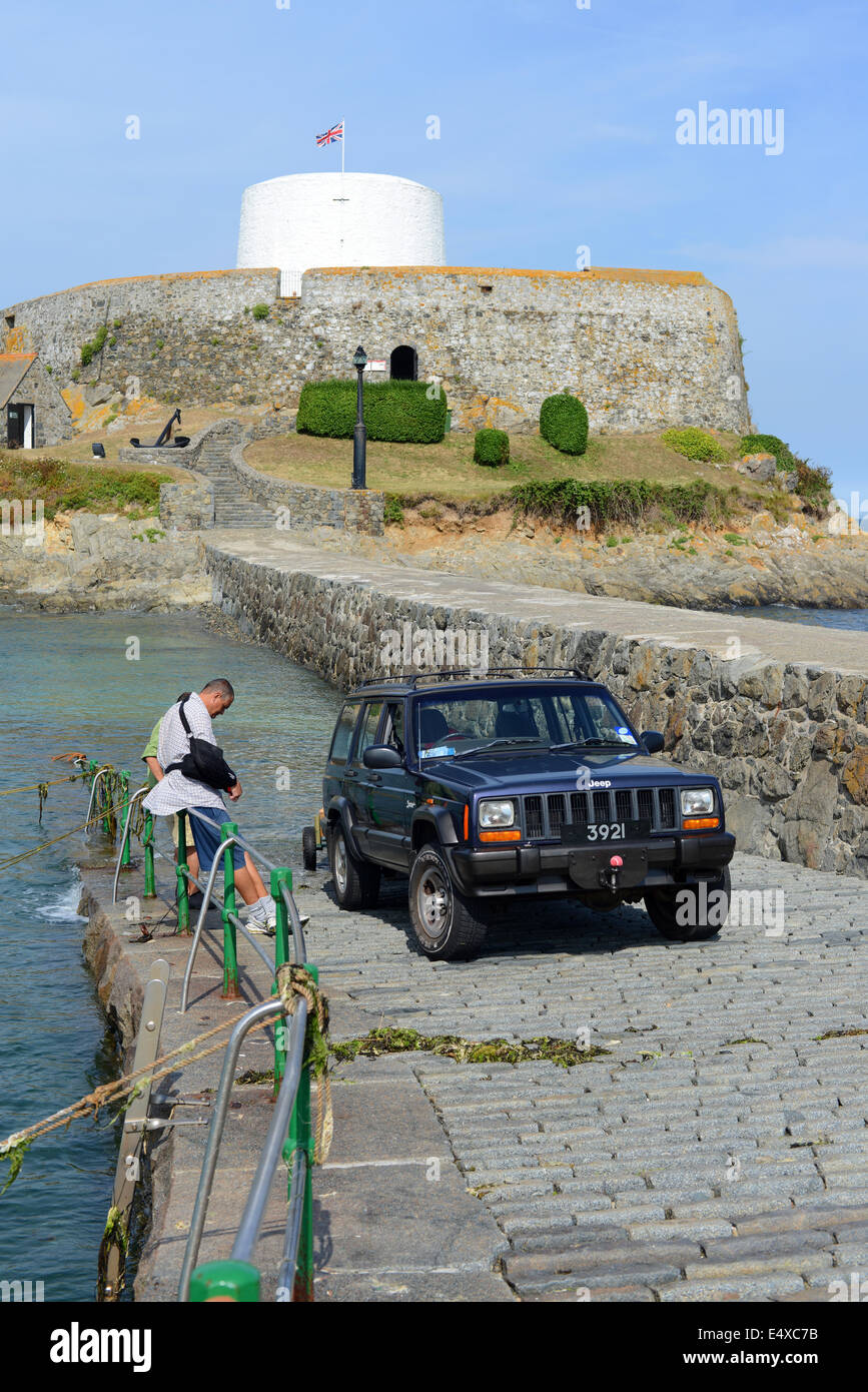 Jeep on slipway to Rocquaine Bay near Fort Grey, Guernsey, Channel Islands Stock Photo