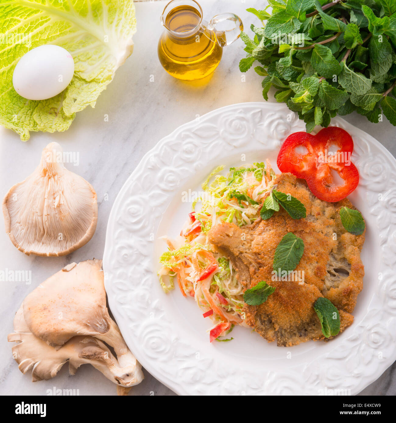 baked oyster mushrooms with fresh savoy cabbage salad Stock Photo Alamy