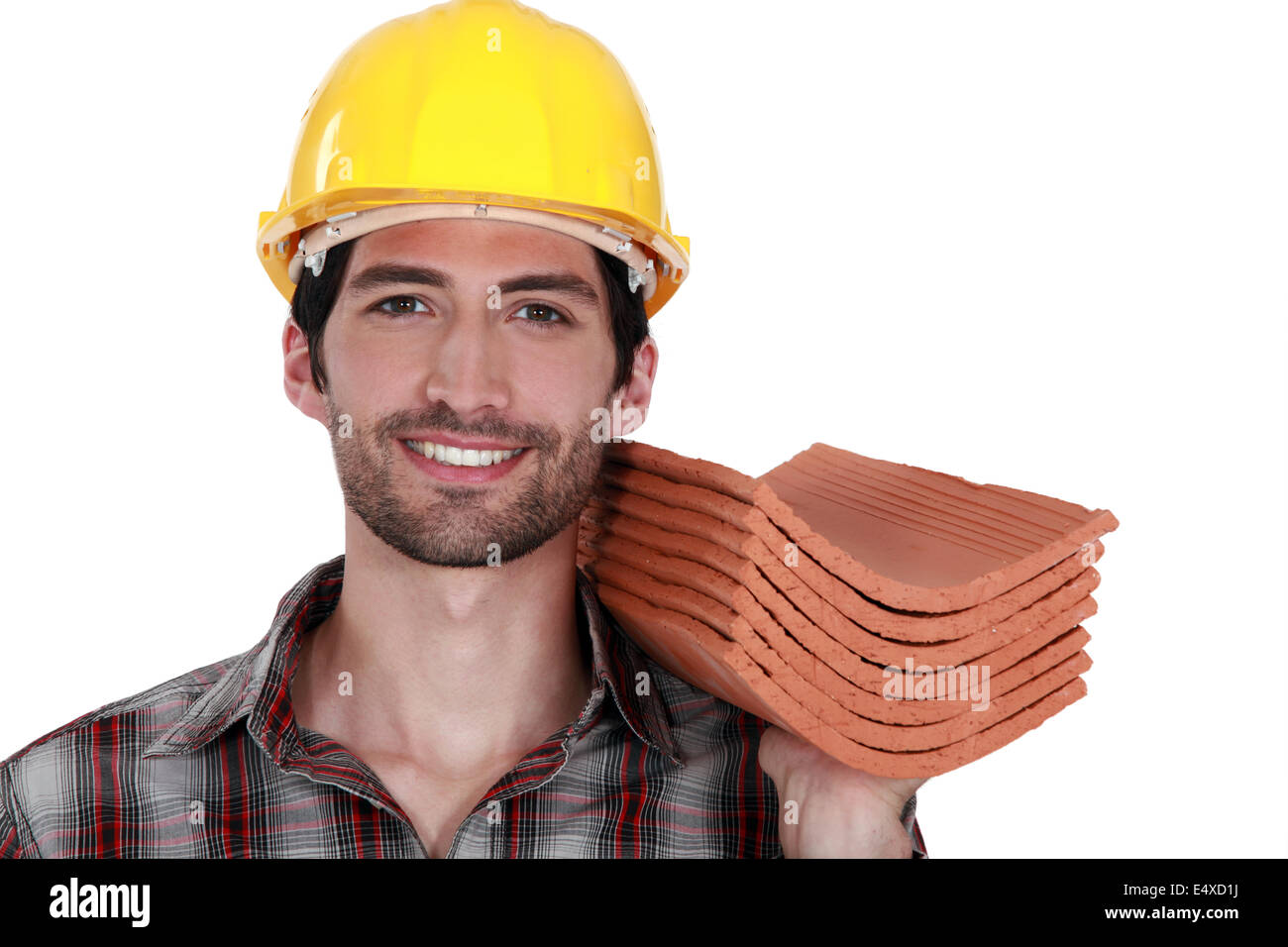 Tradesman holding shingles Stock Photo