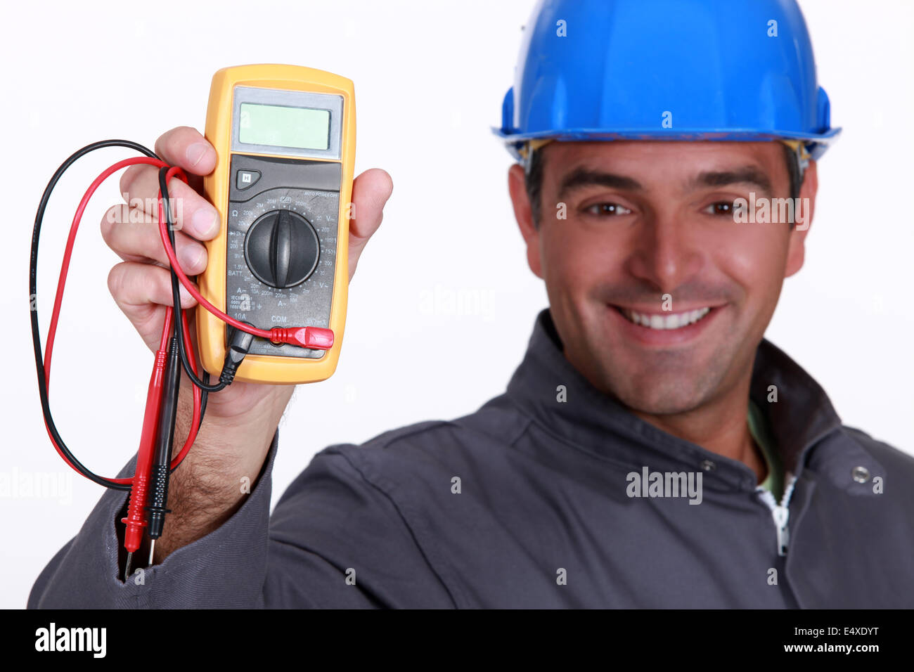 Electrician holding voltmeter Stock Photo