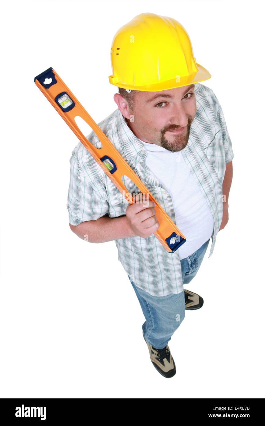Tradesman holding a spirit level Stock Photo
