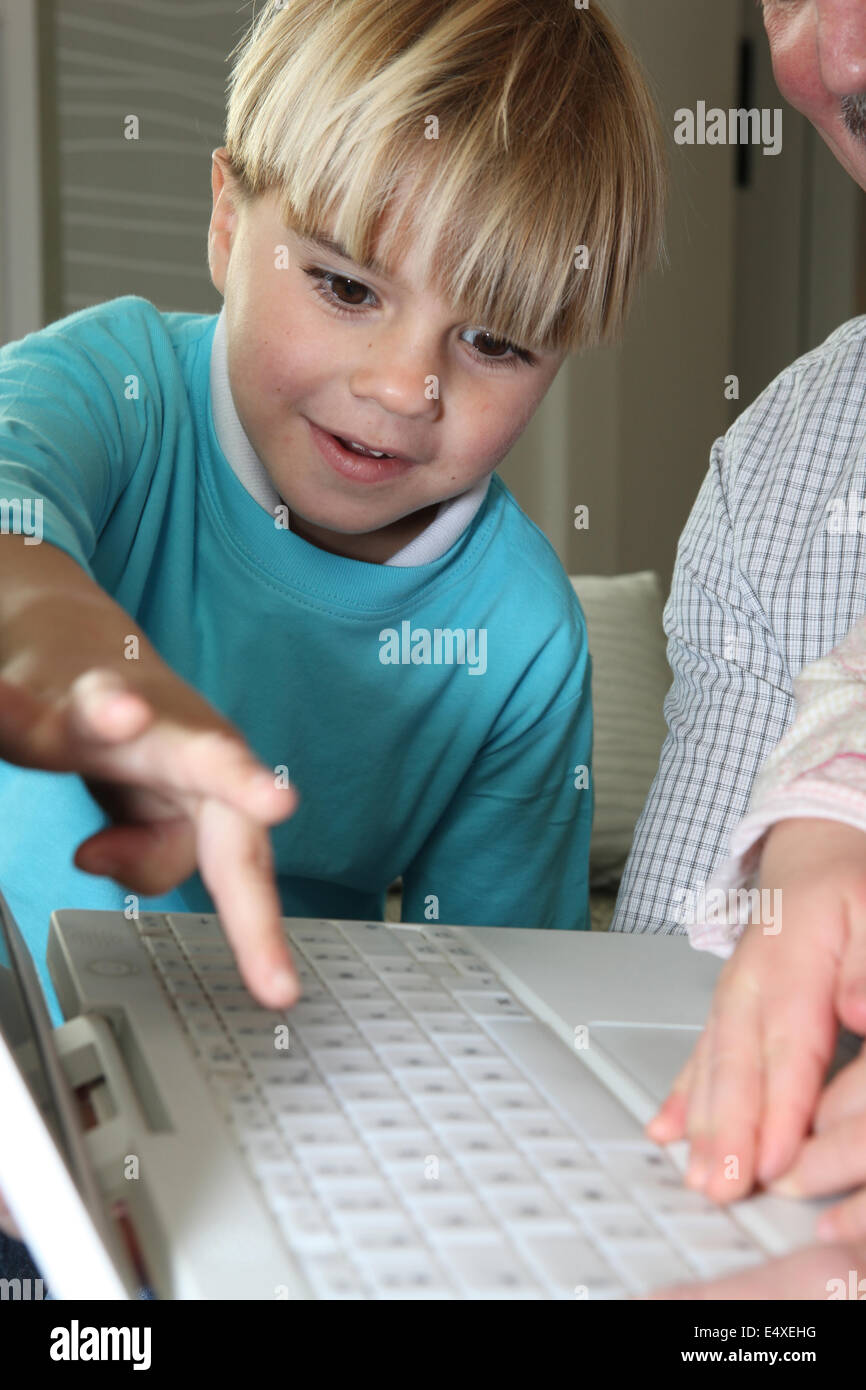 Boy learning computer skills Stock Photo