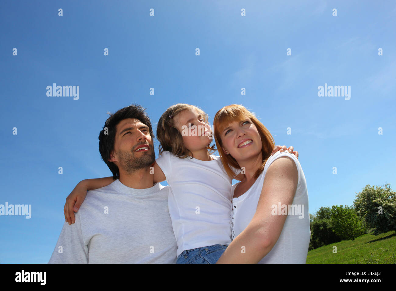 Young family outdoors on a sunny day Stock Photo