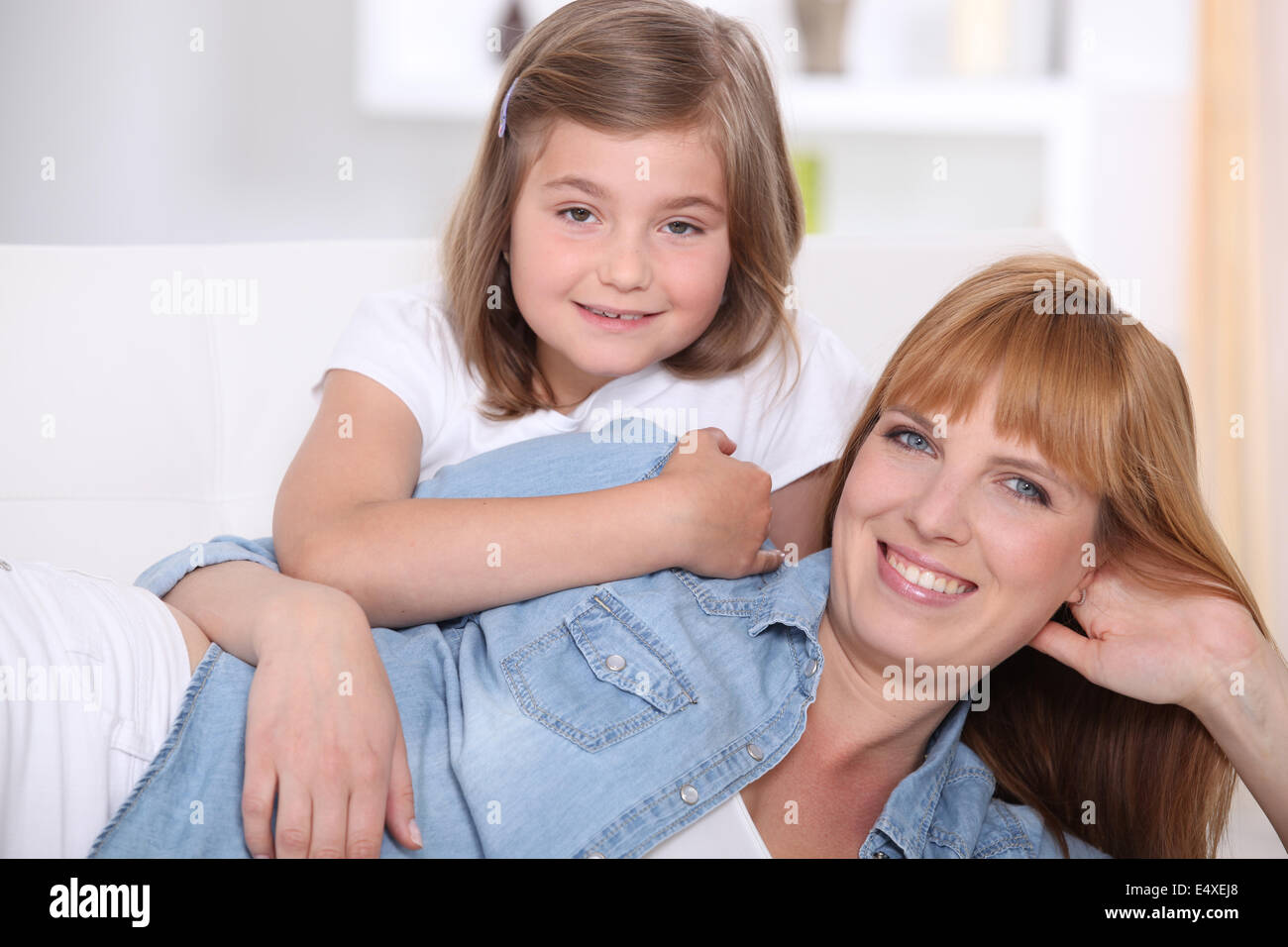 Mother and daughter at home Stock Photo - Alamy