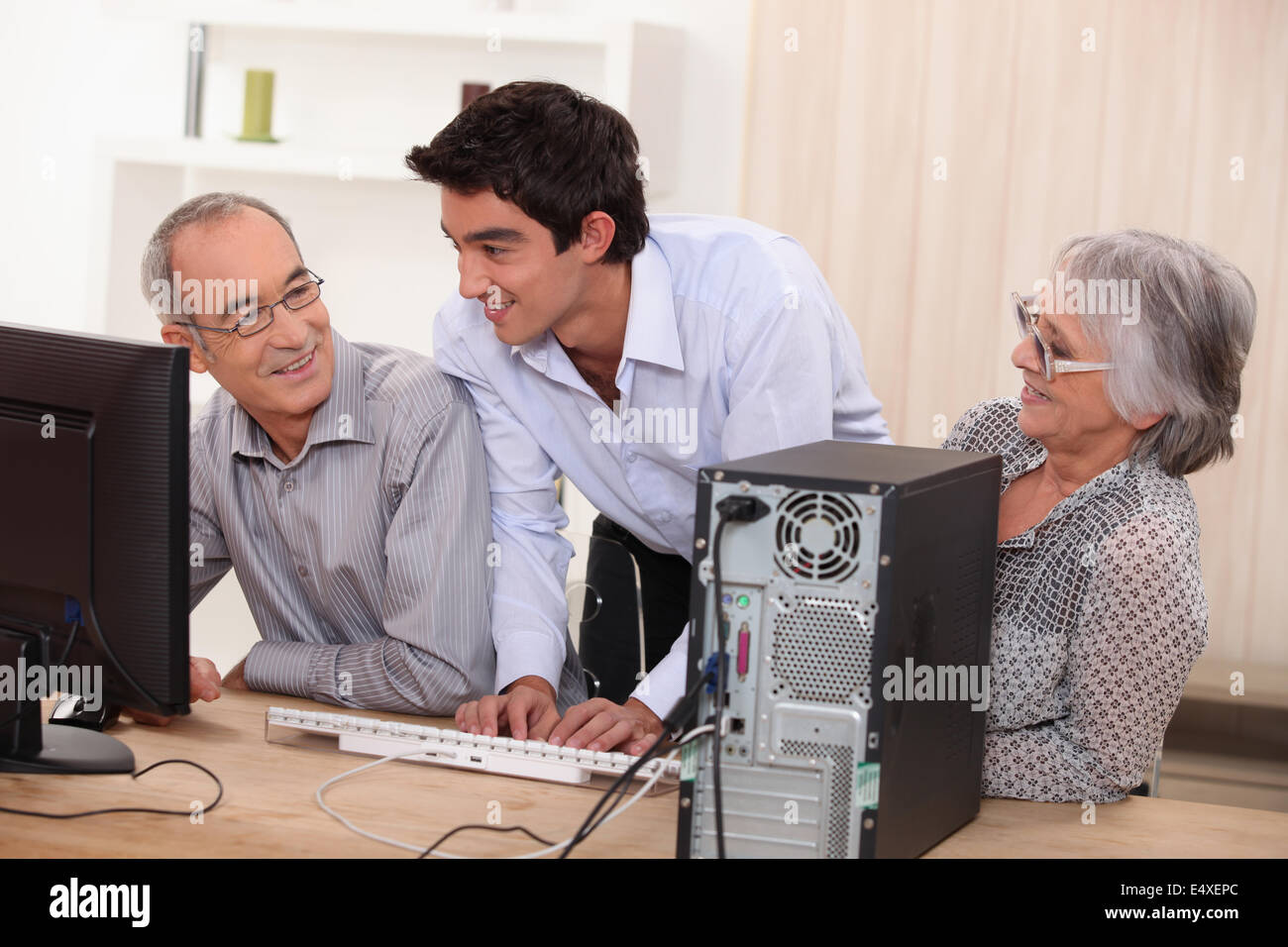 elderly couple in front of a computer Stock Photo