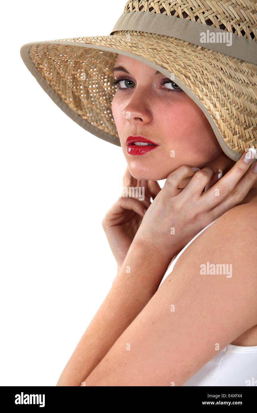 Woman posing in straw hat Stock Photo