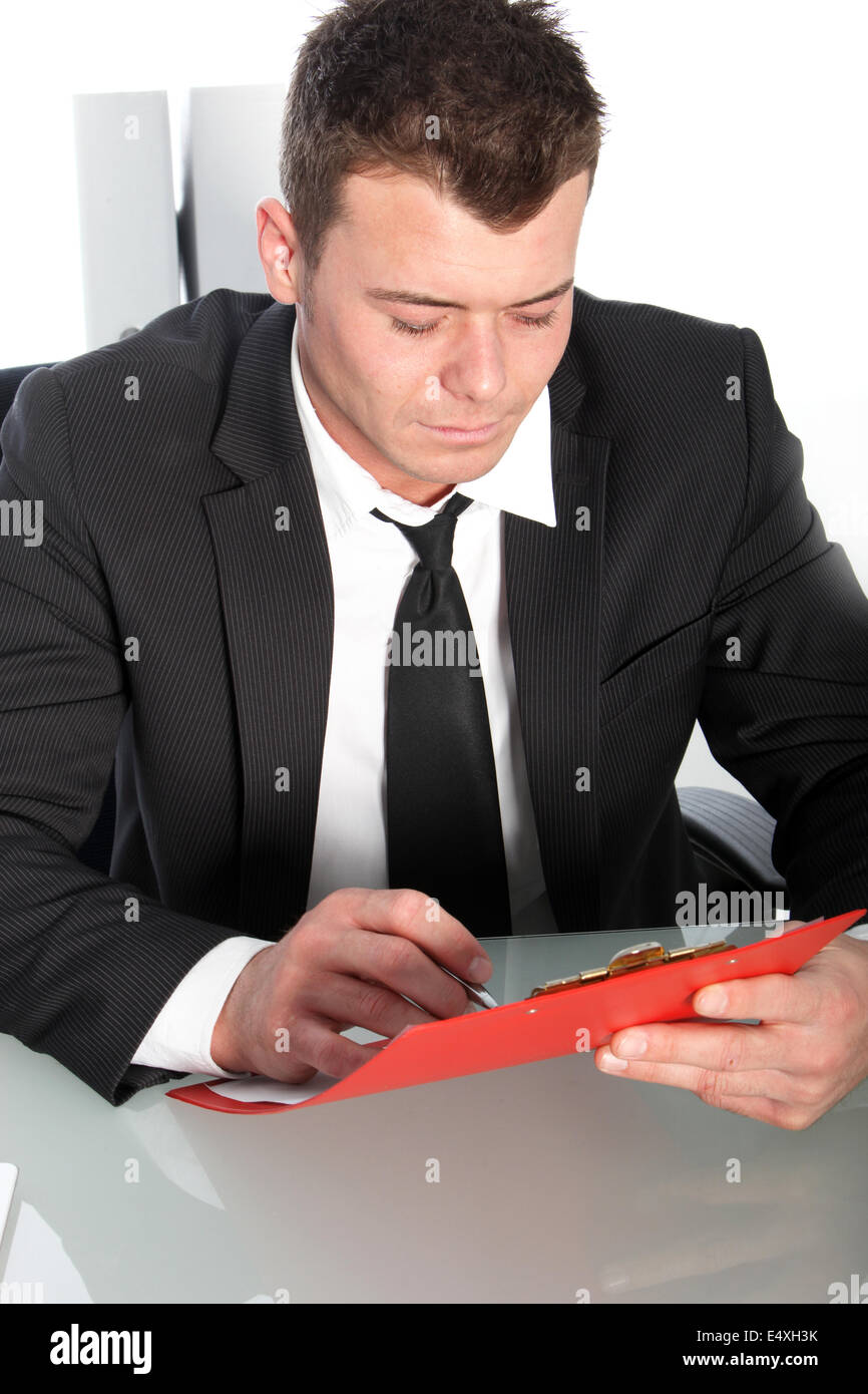 Professional young man studying a file Stock Photo