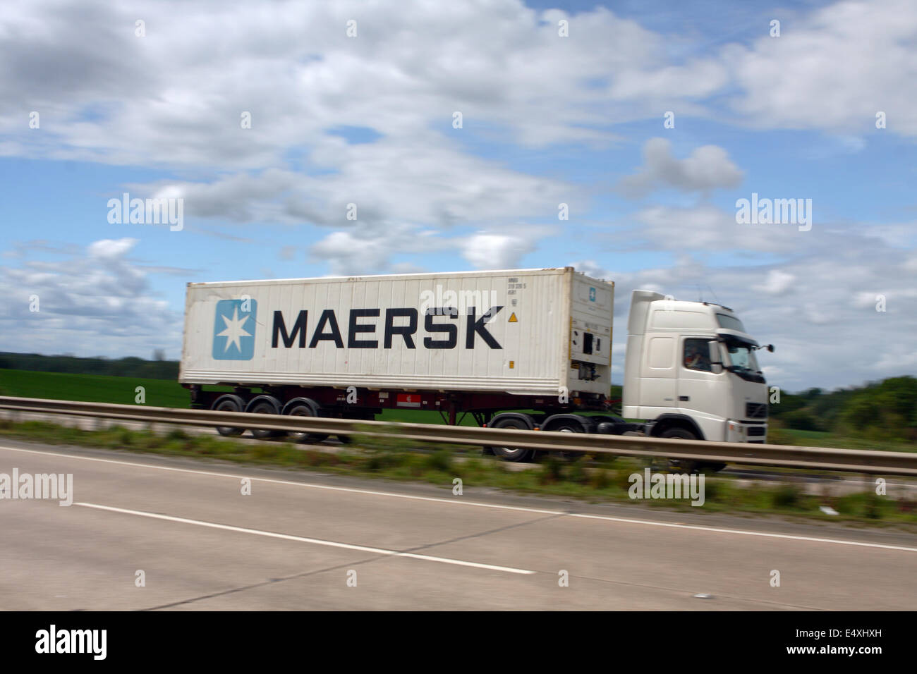 A Maersk shipping container being hauled along the A12 dual carriageway in Essex, England Stock Photo