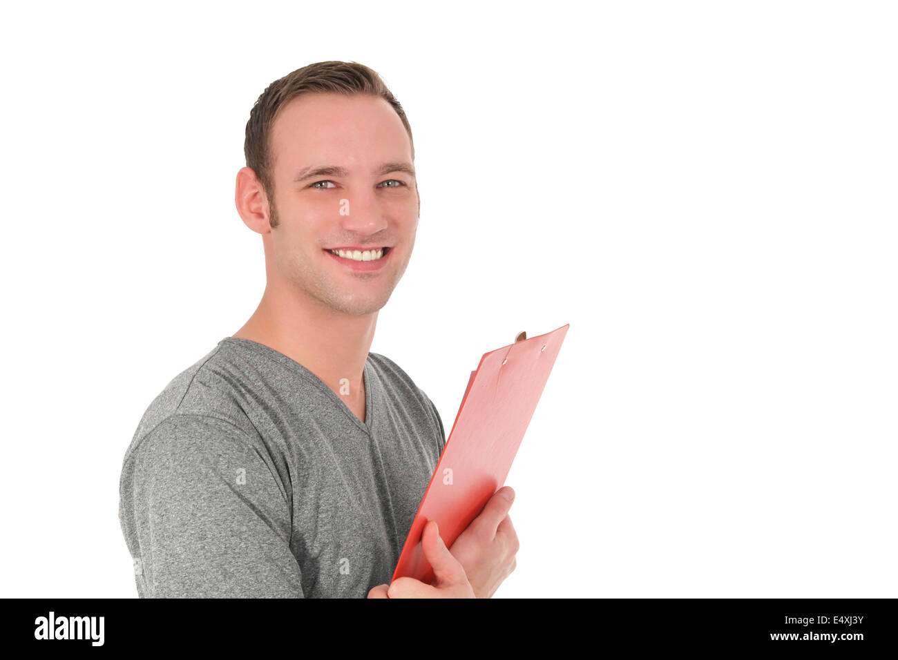 Handsome smiling man holding a clipboard Stock Photo