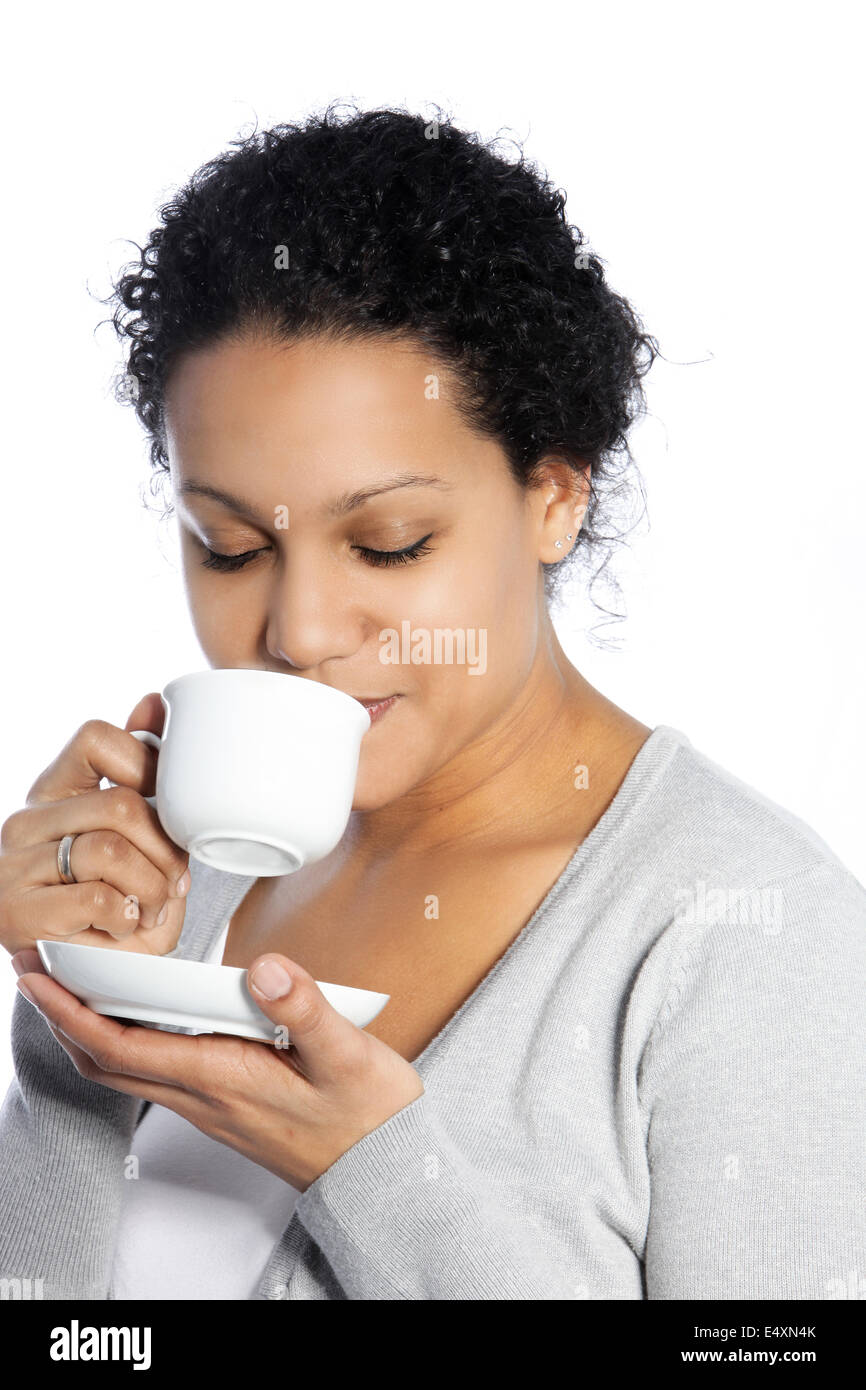 Dark skinned lady enjoys her coffee Stock Photo