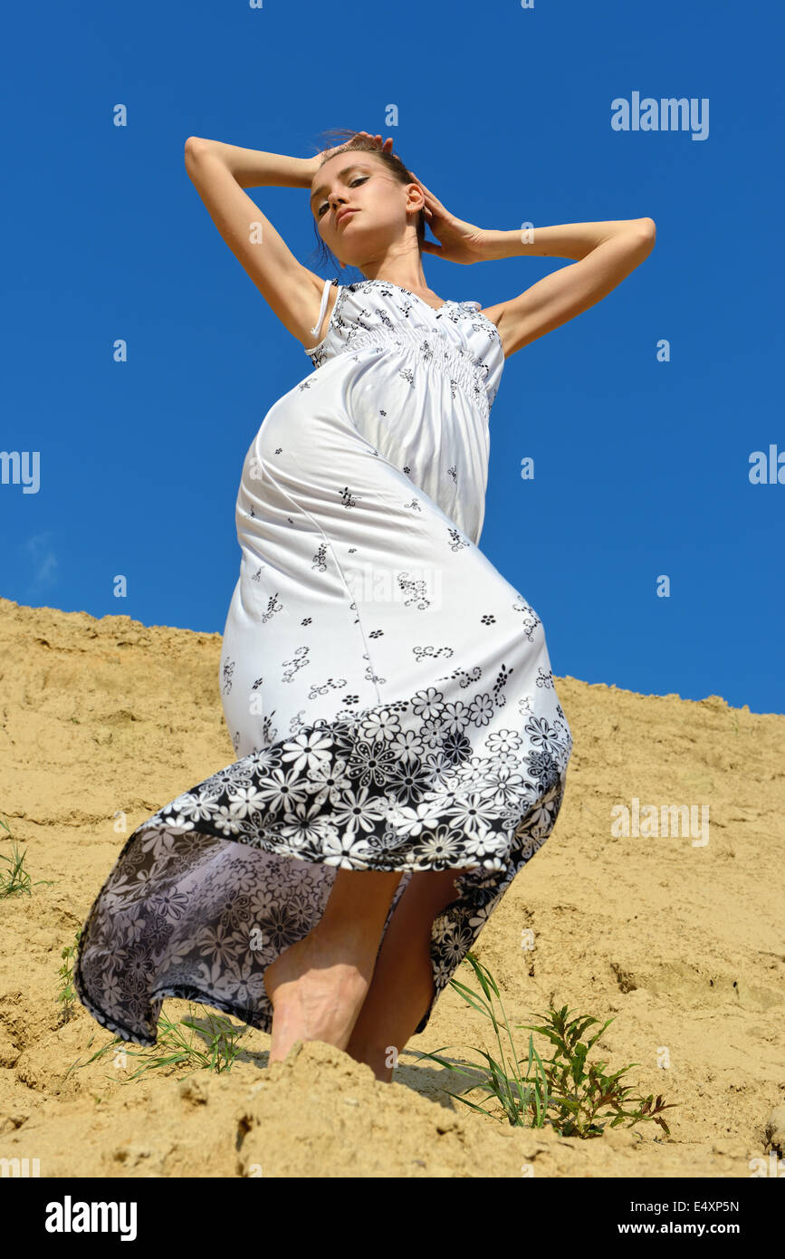 Beautiful woman posing at the sand place Stock Photo - Alamy
