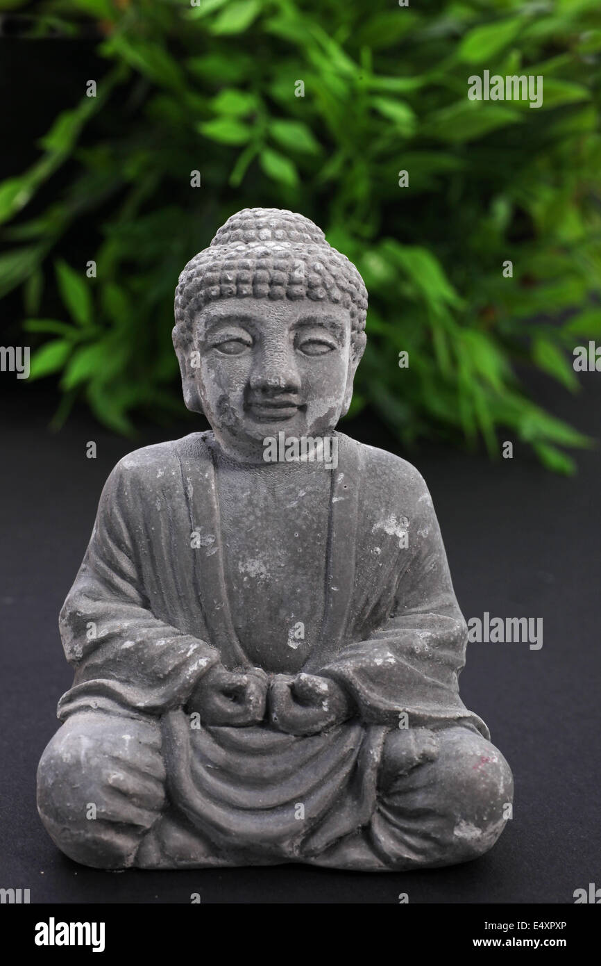 Stone meditating Buddha statue Stock Photo Alamy