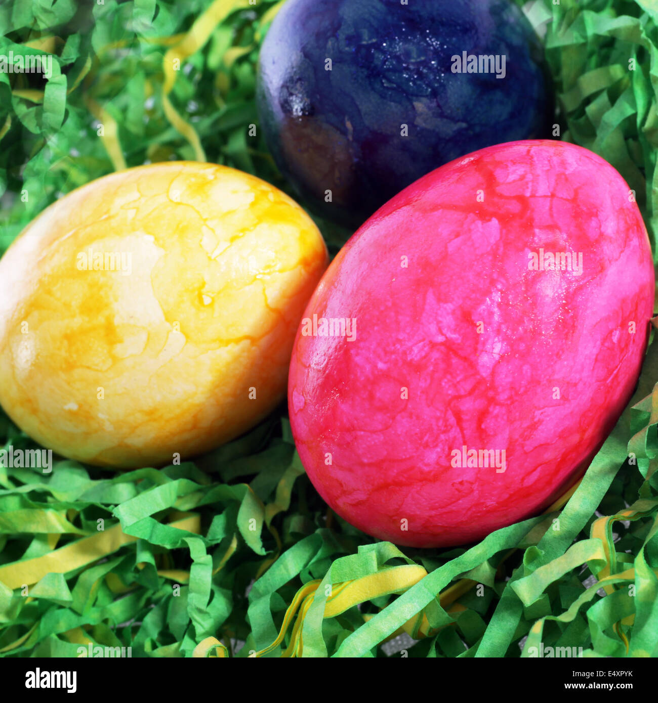 Easter painted eggs in artificial grass Stock Photo - Alamy