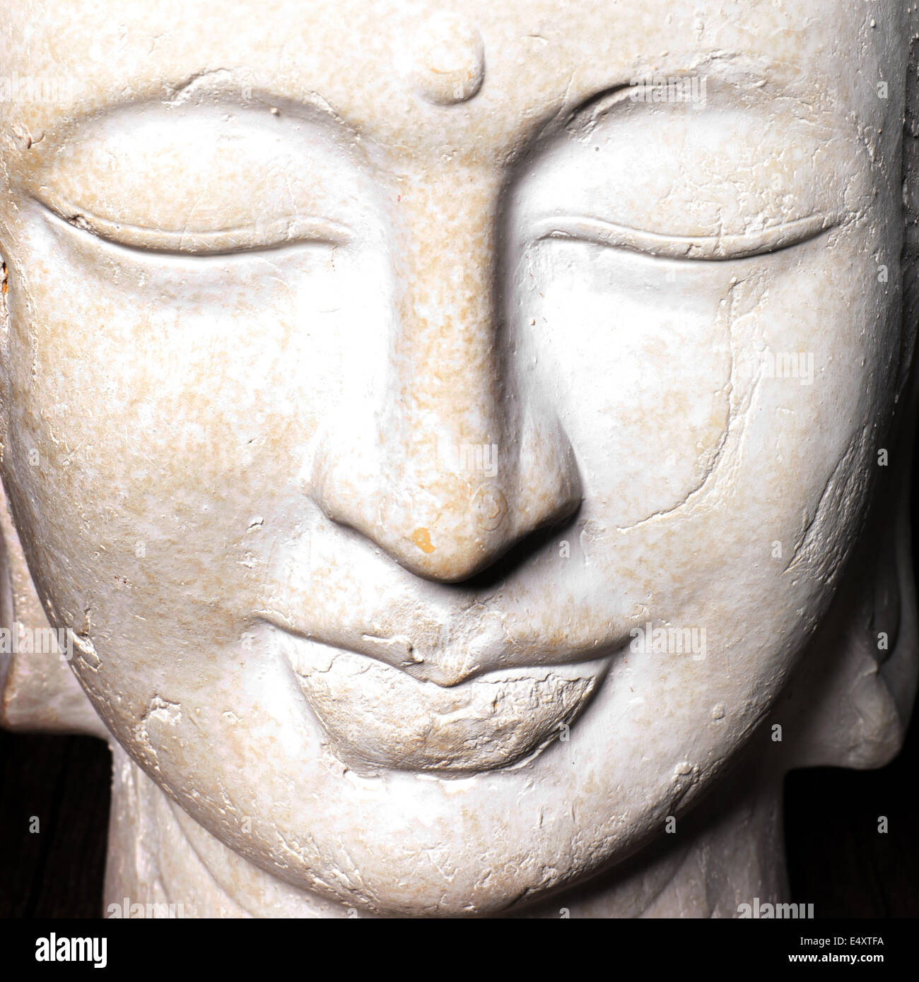 Serene face of a stone Buddha Stock Photo