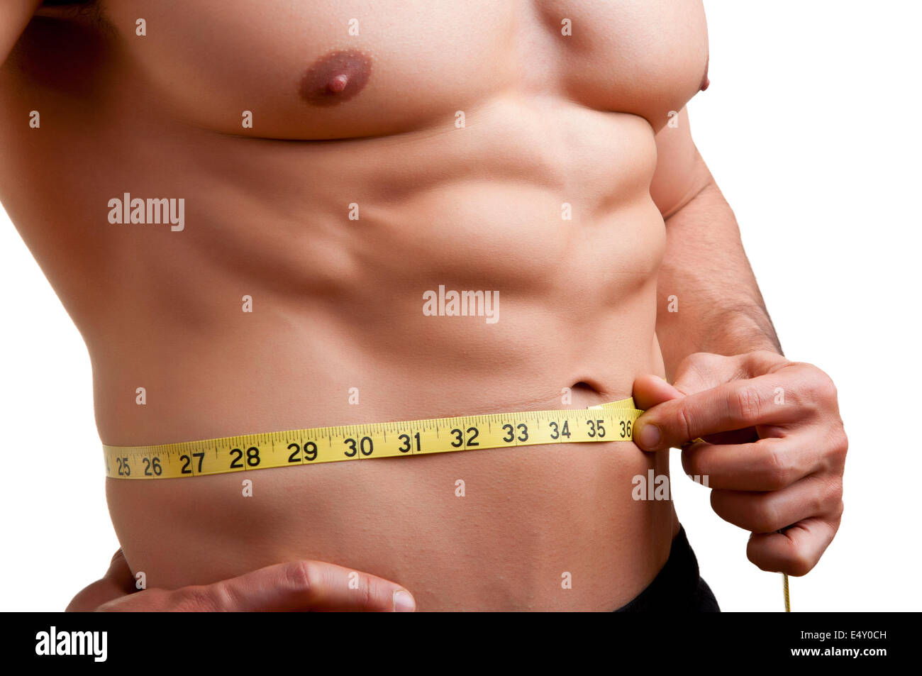Fit Man Measuring His Waist Stock Photo