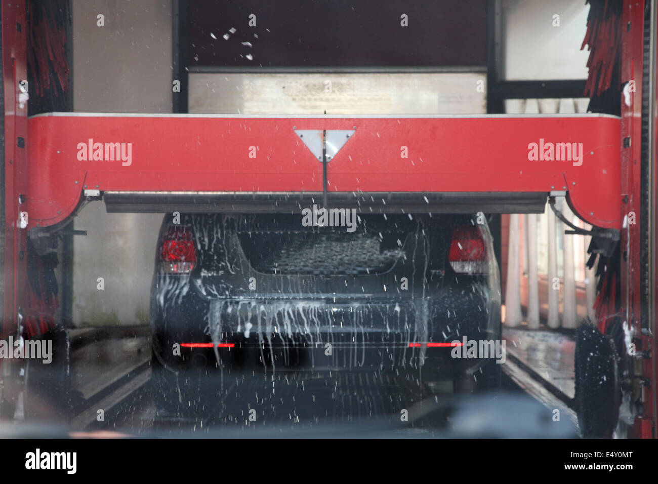 Car being washed in an automated car wash Stock Photo