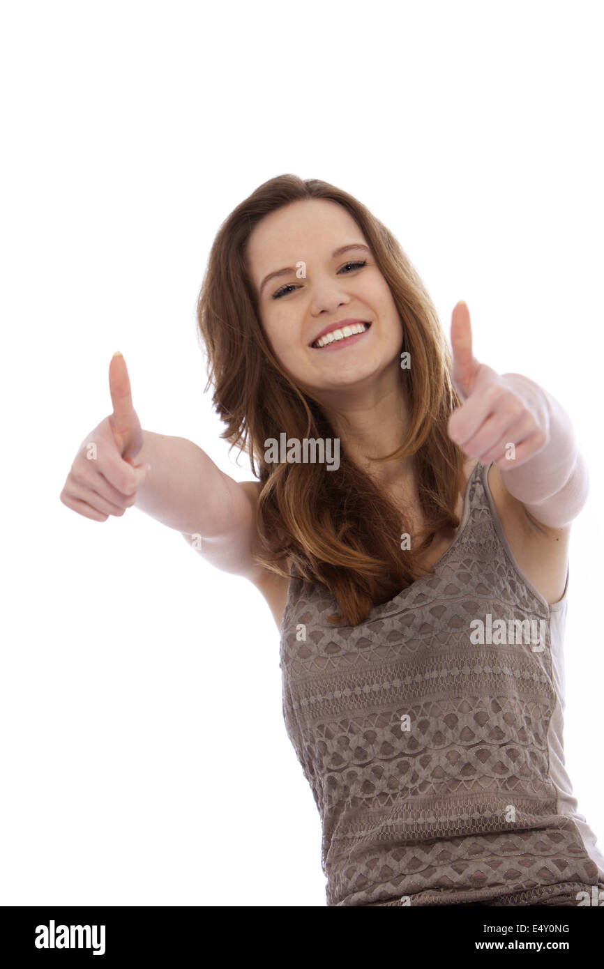 Vivacious teenager giving a thums up Stock Photo