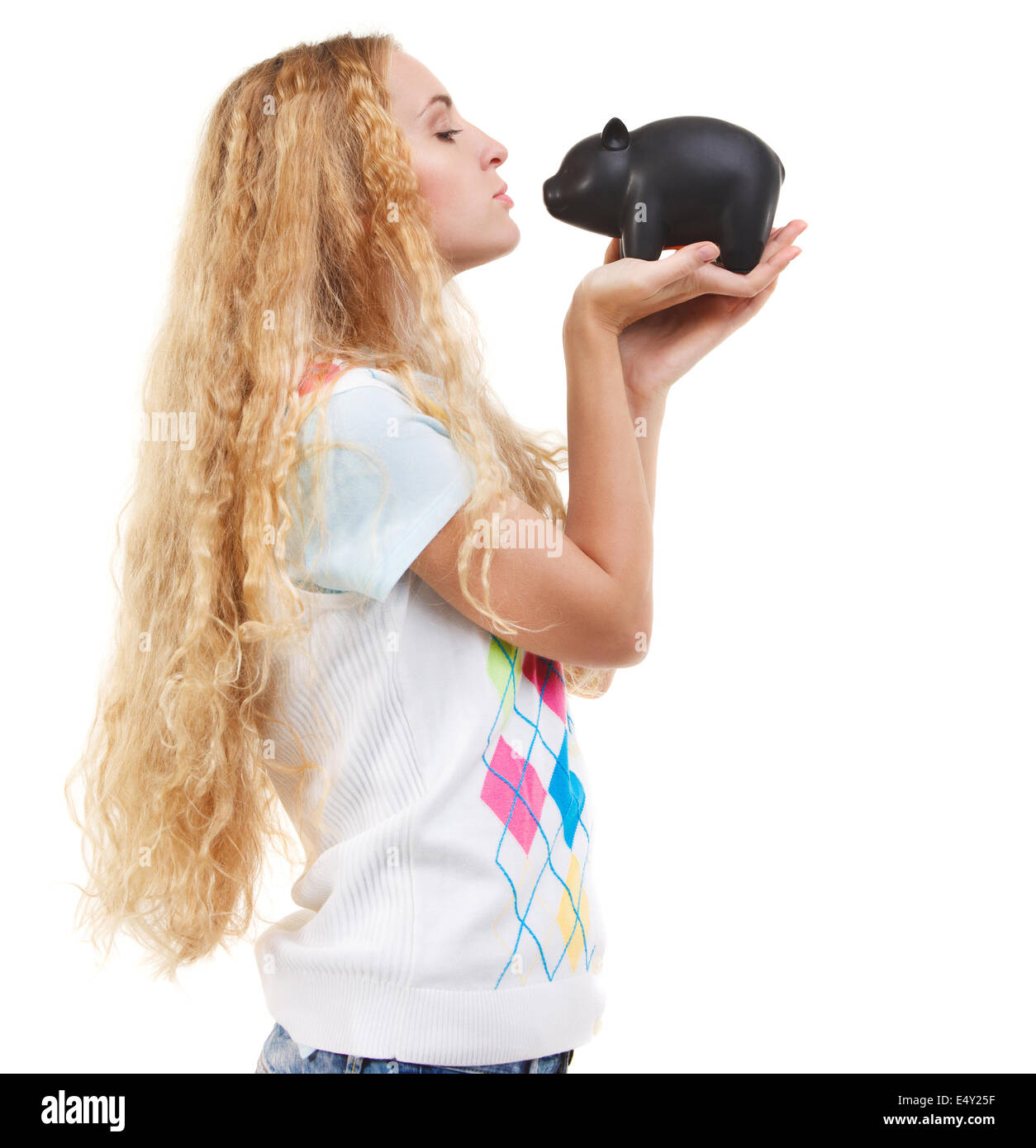 Young woman saving money in a piggybank Stock Photo - Alamy