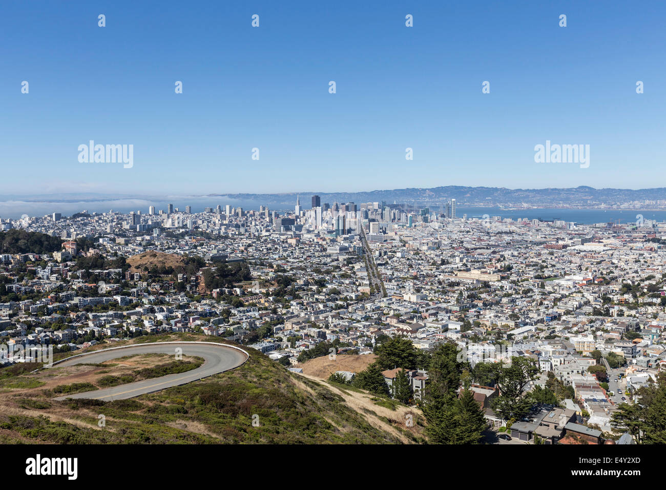 Twin Peaks road and San Francisco's expansive cityscape. Stock Photo