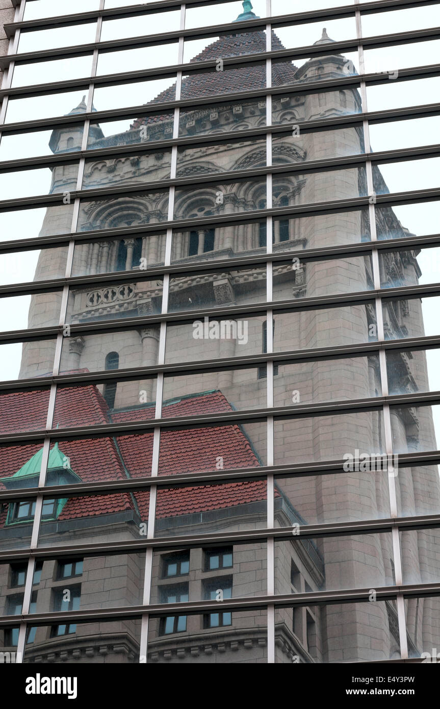 historic landmark center building in saint paul reflected in glass of high rise Stock Photo