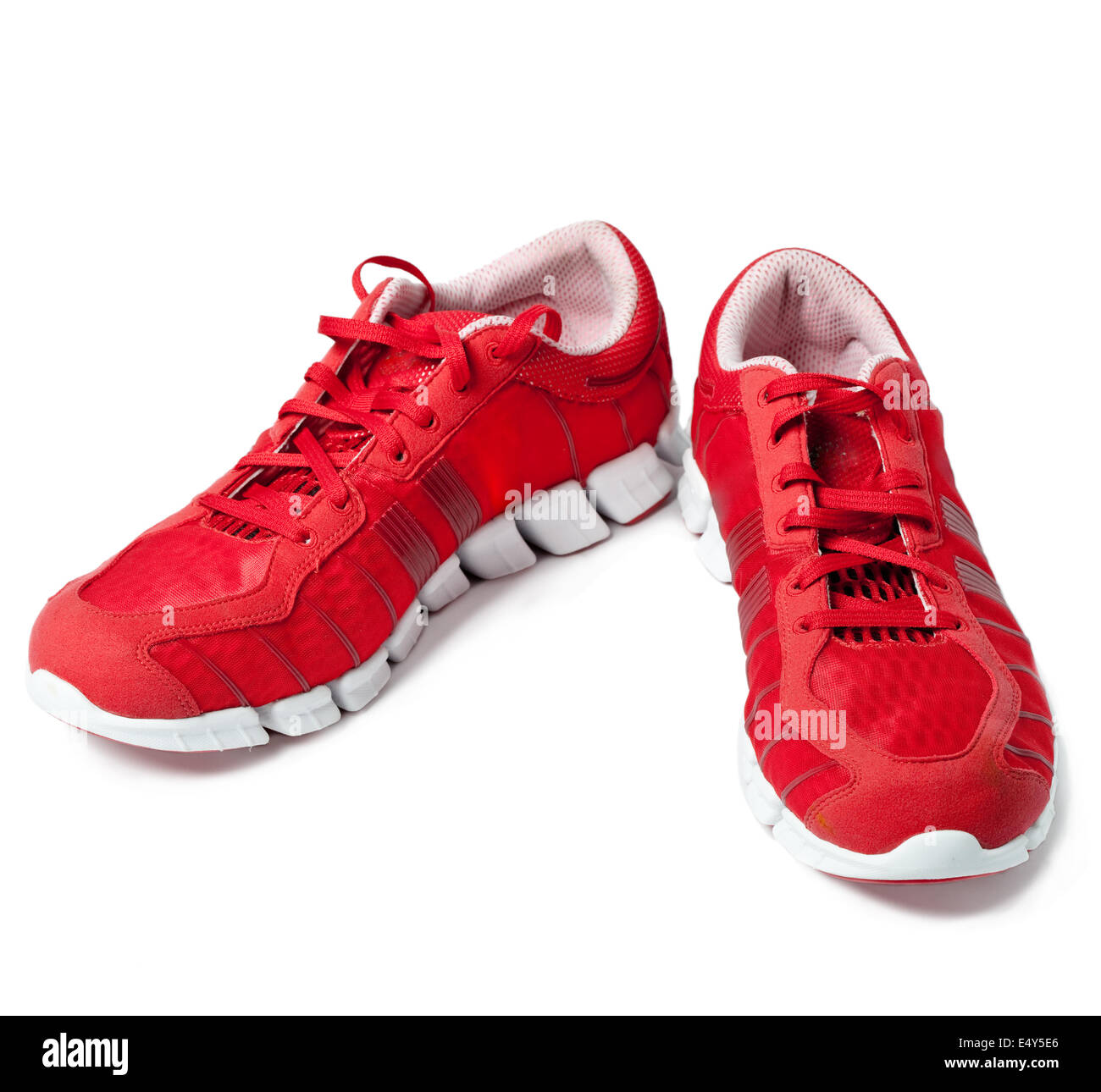 Brightly red trainers Stock Photo