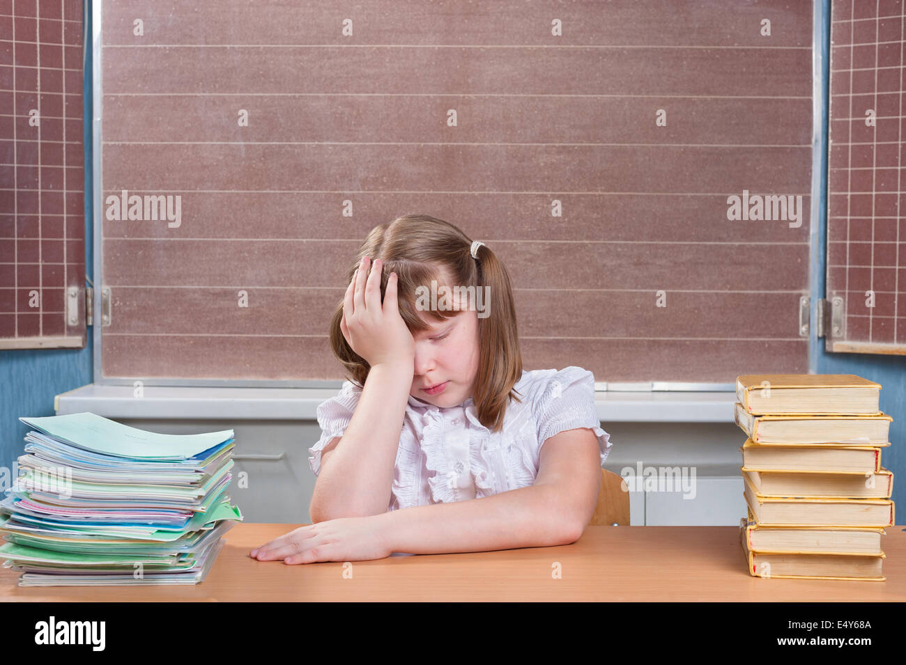 Schoolgirl in a classroom Stock Photo - Alamy