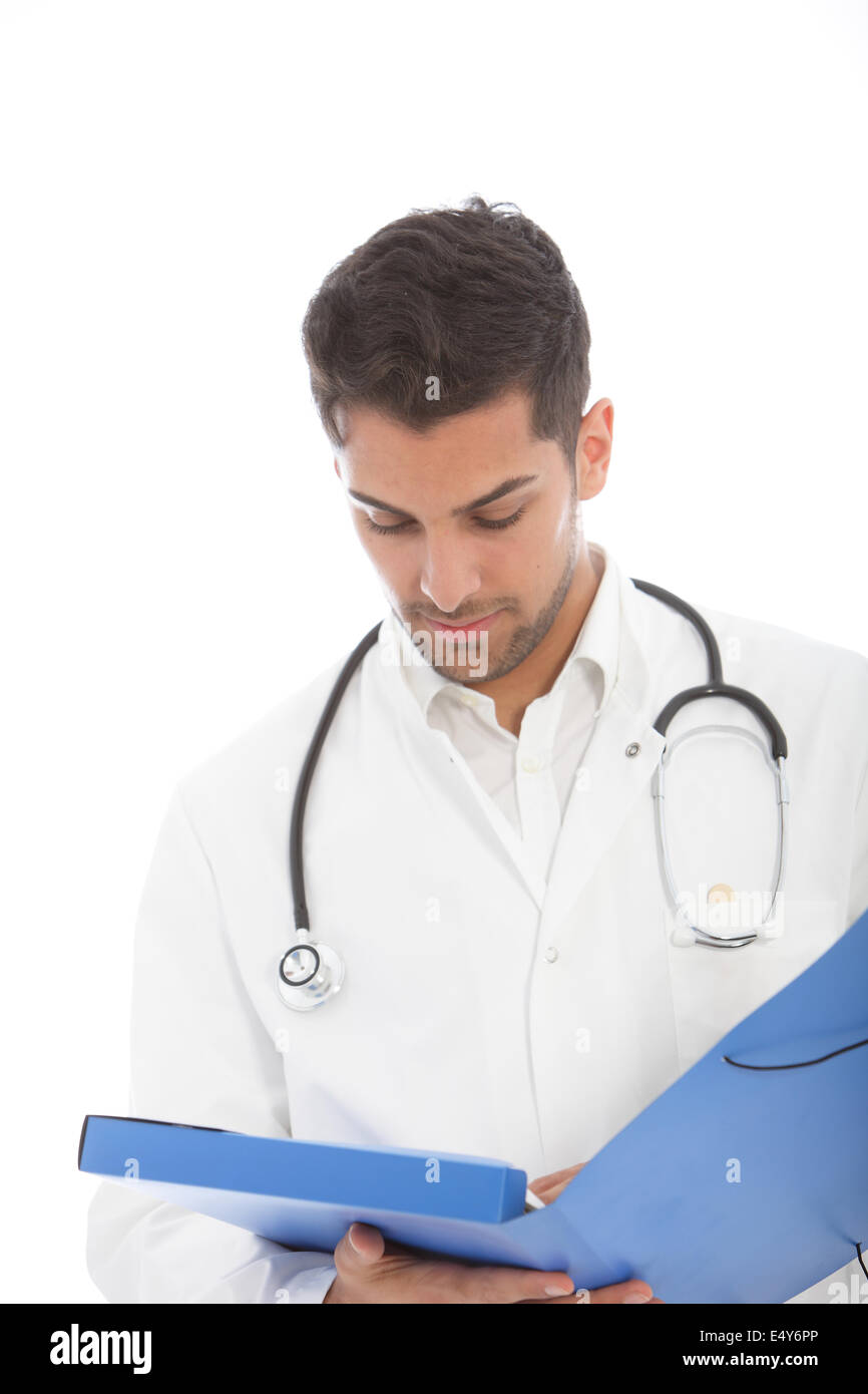 Male doctor reading a patients records Stock Photo
