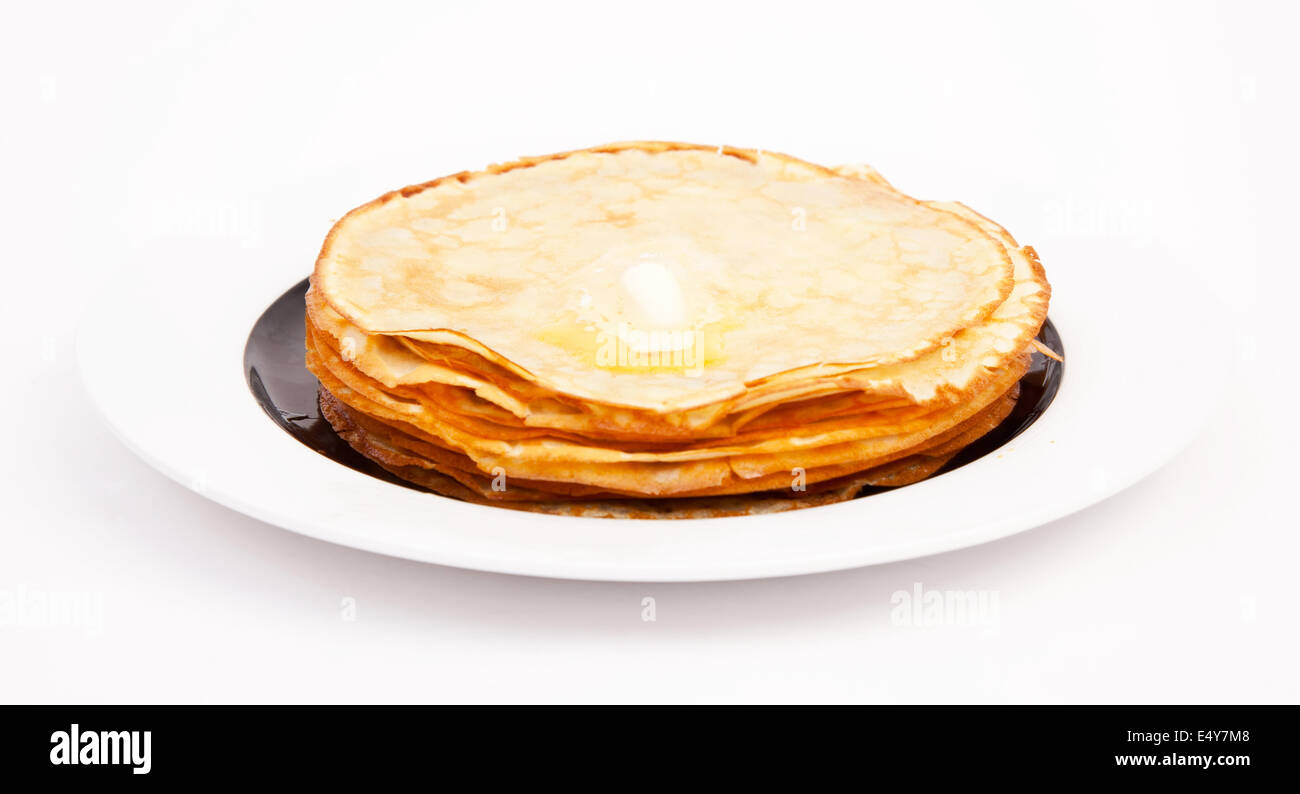 Crepes on white plate wit butter Stock Photo