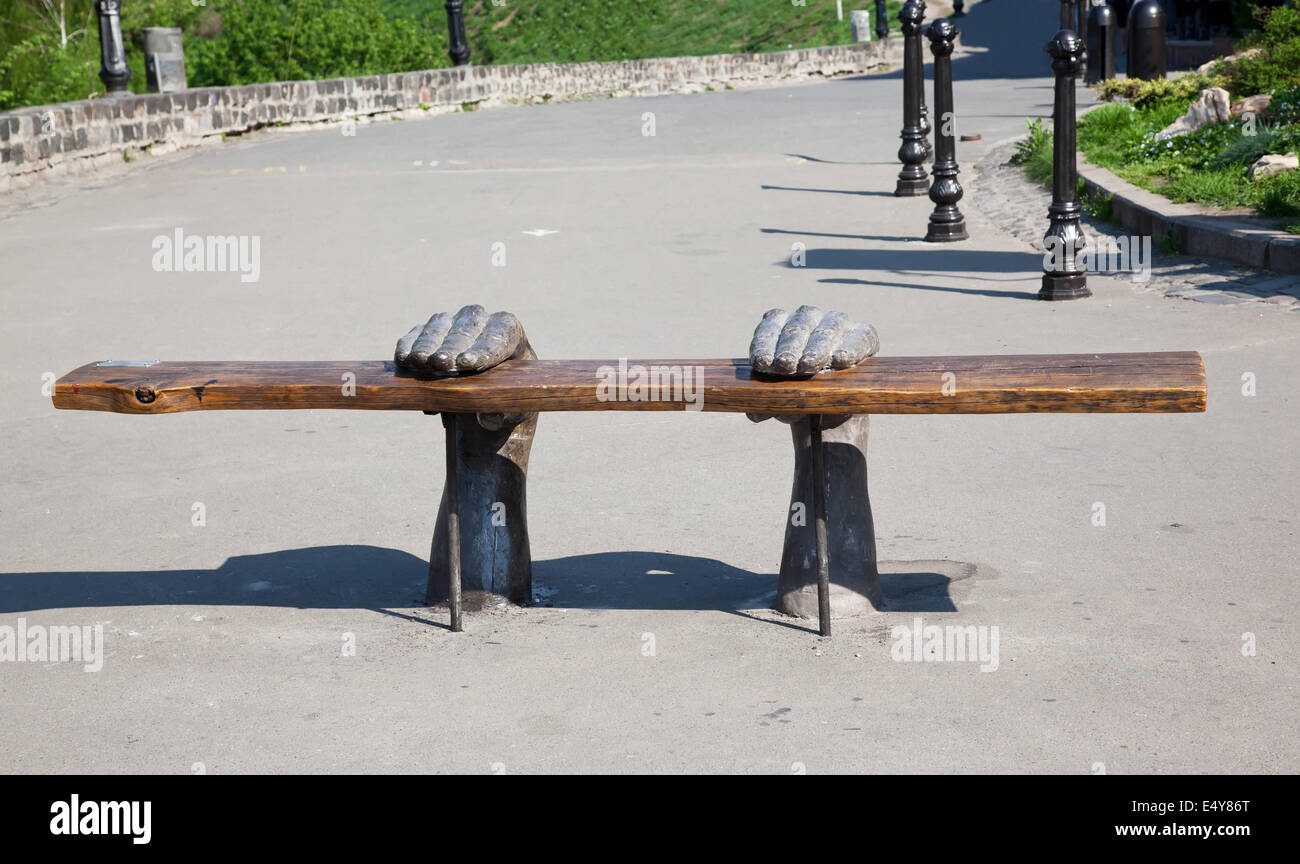 Bench with hands Stock Photo - Alamy