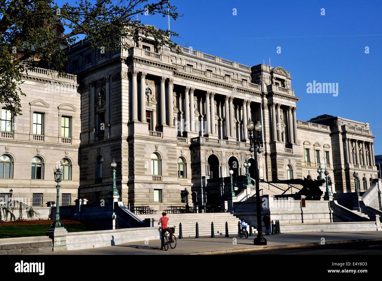 Washington, DC:  A bicyclist pauses in front of the Beaux Arts facade of the Jefferson Building at the Library of Congress Stock Photo